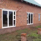 Maatskappy 6 beeld PHOENIX ALUMINIUM Stackaway Door in East London EC